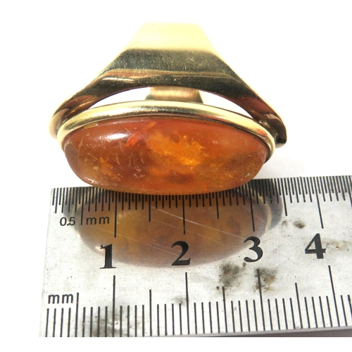 269 - Stunning 9ct Yellow Gold Ring set with a large oval Amber Cabouchon. Ring size 'M'  Inclusions to Am... 