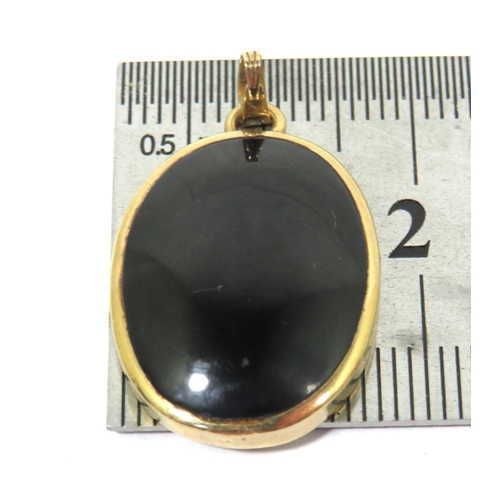 270 - Black Onyx Cabouchon pendant set in a 9ct Yellow Gold Mount .  Pendant measures approx 30 x 19 mm. s... 