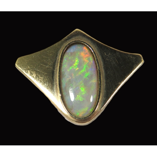 272 - 9ct Yellow Gold Brooch/ Pendant set with an Oval Opal which measures 19 x 9 mm.  Hallmarked for Lond... 