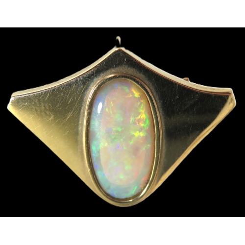 272 - 9ct Yellow Gold Brooch/ Pendant set with an Oval Opal which measures 19 x 9 mm.  Hallmarked for Lond... 