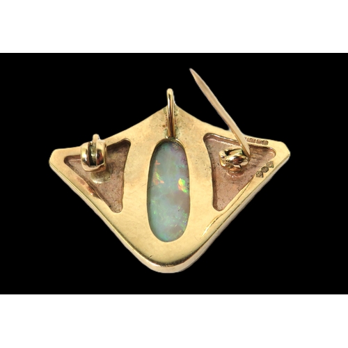 272 - 9ct Yellow Gold Brooch/ Pendant set with an Oval Opal which measures 19 x 9 mm.  Hallmarked for Lond... 