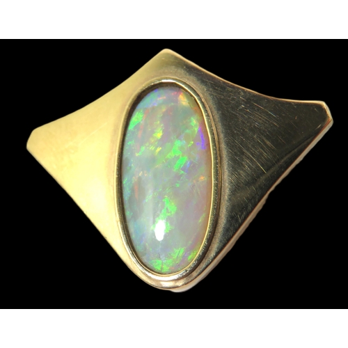 272 - 9ct Yellow Gold Brooch/ Pendant set with an Oval Opal which measures 19 x 9 mm.  Hallmarked for Lond... 