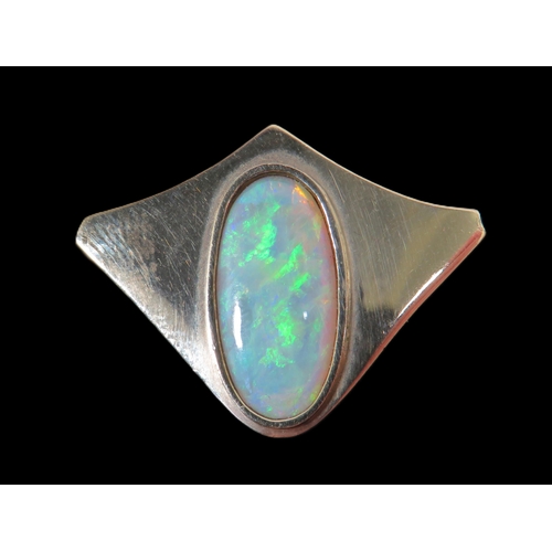 272 - 9ct Yellow Gold Brooch/ Pendant set with an Oval Opal which measures 19 x 9 mm.  Hallmarked for Lond... 