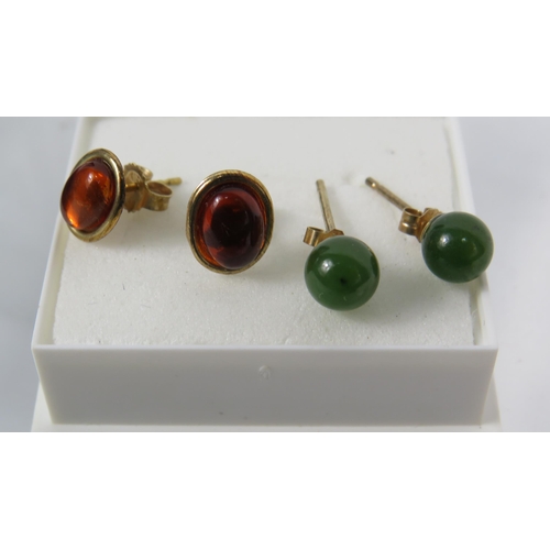 173 - Two Pairs of 9ct Ear studs, one pair set with Amber, the other set with Jade/ Neophrite.   See photo... 