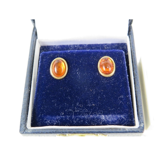 173 - Two Pairs of 9ct Ear studs, one pair set with Amber, the other set with Jade/ Neophrite.   See photo... 