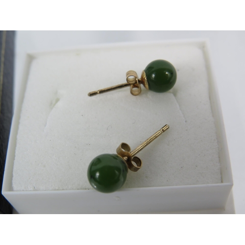 173 - Two Pairs of 9ct Ear studs, one pair set with Amber, the other set with Jade/ Neophrite.   See photo... 