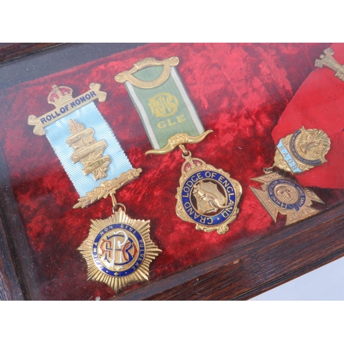 177 - RAOB Masonic medals, sash and ephemera plus a dispay case.