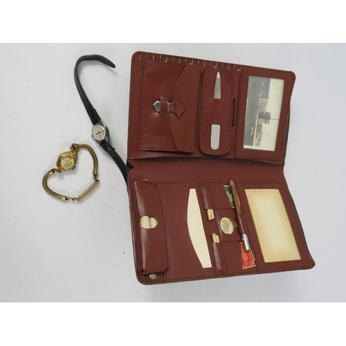 181 - Two Vintage ladies mechanical wristwatches and a vintage leather wallet with contents.