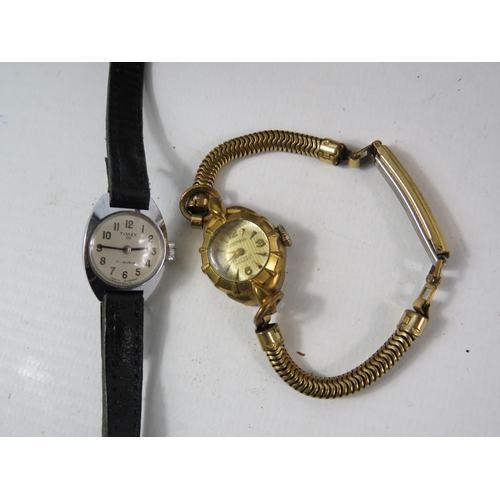 181 - Two Vintage ladies mechanical wristwatches and a vintage leather wallet with contents.