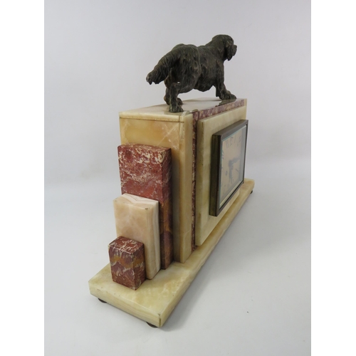 183 - Large French art deco marble mantle clock with bronze alloy gun dog figure to the top, in running or... 