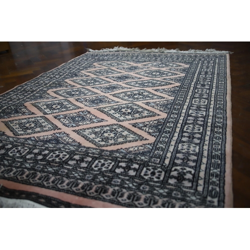 903 - Eastern Rug from Lahore with traditional designs. Tasselled ends in Very Good Condition . Measures a... 