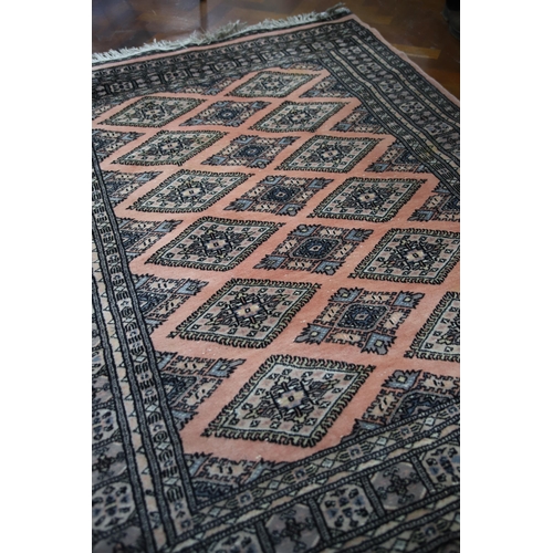 903 - Eastern Rug from Lahore with traditional designs. Tasselled ends in Very Good Condition . Measures a... 