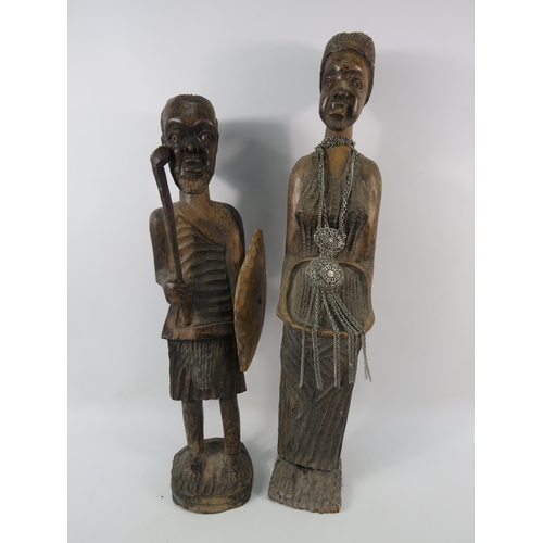 193 - Two large vintage African carved wooden figures, the tallest stands 23 3/4