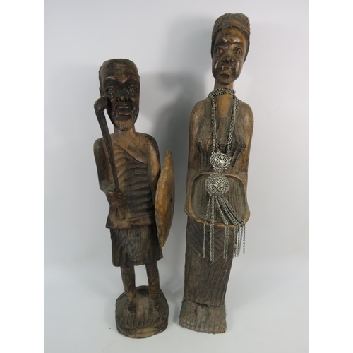 193 - Two large vintage African carved wooden figures, the tallest stands 23 3/4