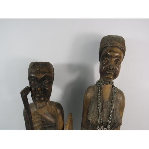 193 - Two large vintage African carved wooden figures, the tallest stands 23 3/4