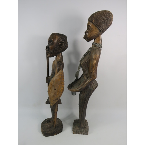 193 - Two large vintage African carved wooden figures, the tallest stands 23 3/4