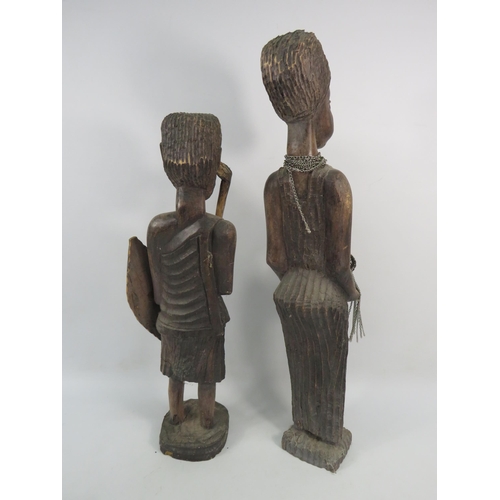 193 - Two large vintage African carved wooden figures, the tallest stands 23 3/4