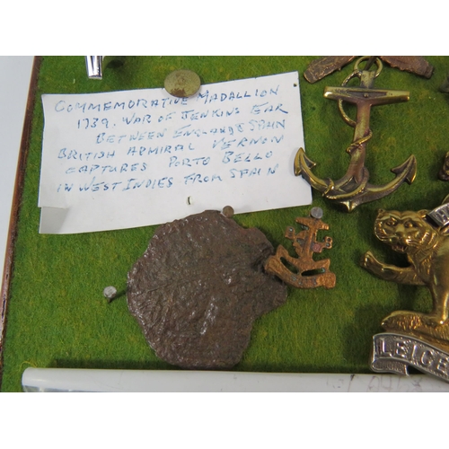 356 - Large selection of Military related cap badges, buttons, metal dectecting finds etc.