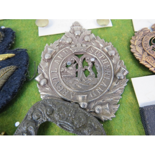 356 - Large selection of Military related cap badges, buttons, metal dectecting finds etc.