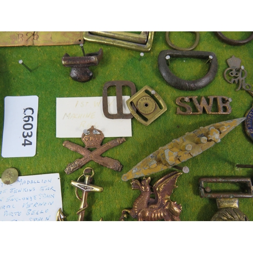 356 - Large selection of Military related cap badges, buttons, metal dectecting finds etc.