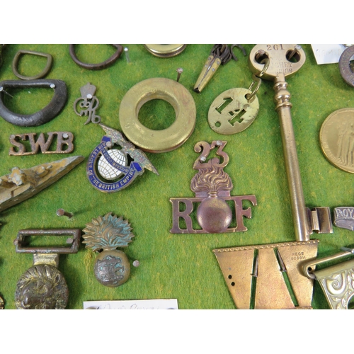 356 - Large selection of Military related cap badges, buttons, metal dectecting finds etc.