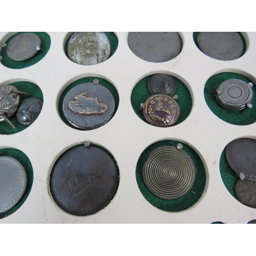 357 - Large selection of antique buttons from metal detecting displayed on a board.