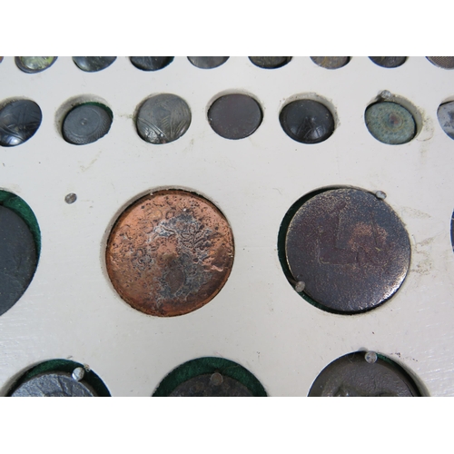 357 - Large selection of antique buttons from metal detecting displayed on a board.