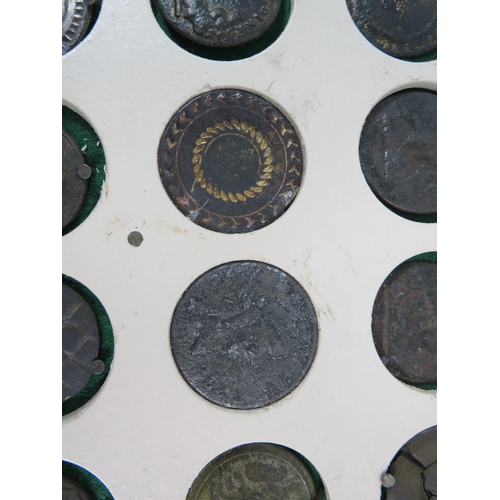 357 - Large selection of antique buttons from metal detecting displayed on a board.