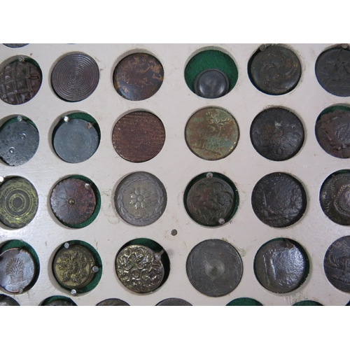 357 - Large selection of antique buttons from metal detecting displayed on a board.