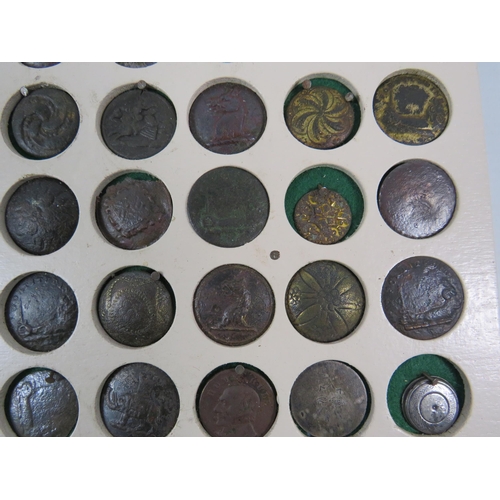 357 - Large selection of antique buttons from metal detecting displayed on a board.