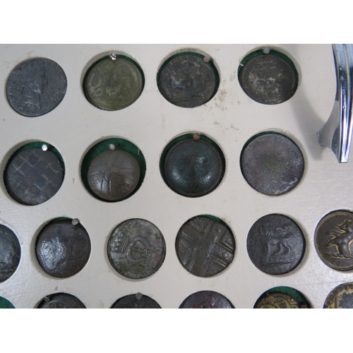 357 - Large selection of antique buttons from metal detecting displayed on a board.