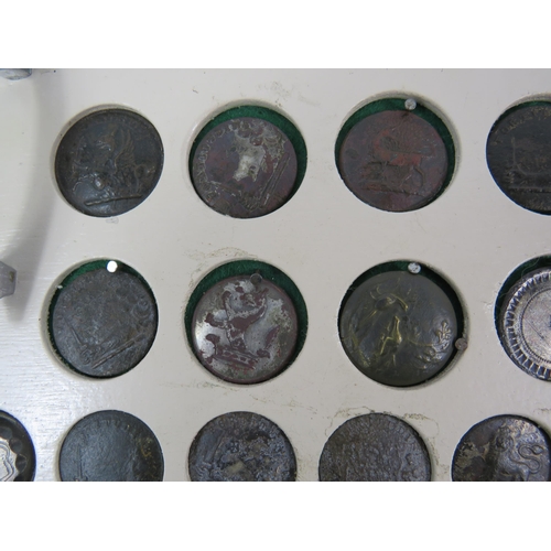 357 - Large selection of antique buttons from metal detecting displayed on a board.