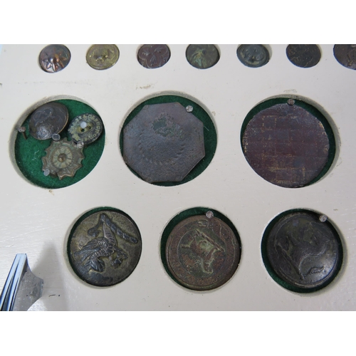 357 - Large selection of antique buttons from metal detecting displayed on a board.