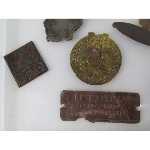 364 - Various antique metal detecting finds plaques and tags, including one from WW1 Ship HMS Minotaur.