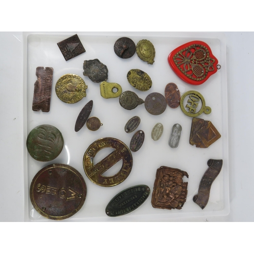 364 - Various antique metal detecting finds plaques and tags, including one from WW1 Ship HMS Minotaur.