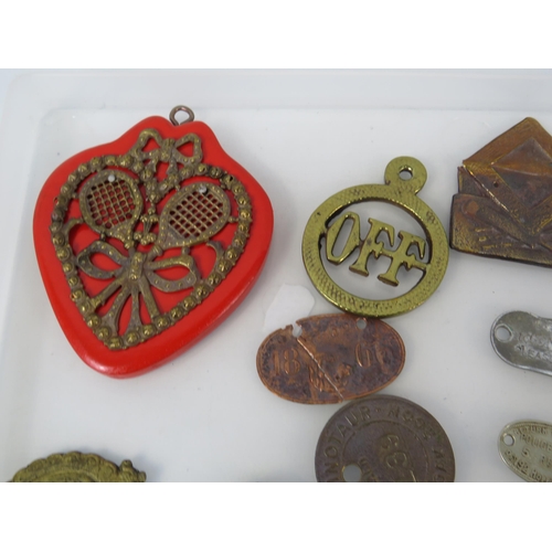 364 - Various antique metal detecting finds plaques and tags, including one from WW1 Ship HMS Minotaur.