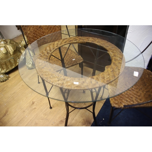 1215 - Garden patio set comprising of a glass topped table with two matching chairs.  Table height is 29 in... 