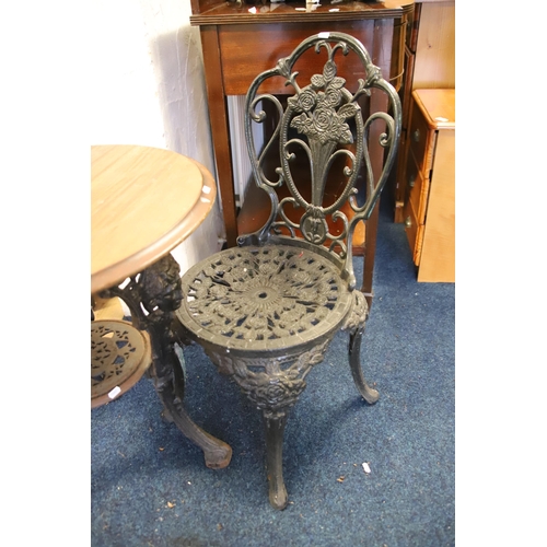 1216 - Garden Patio set comprising of a  wooden topped metal table with pierced decoration together with tw... 