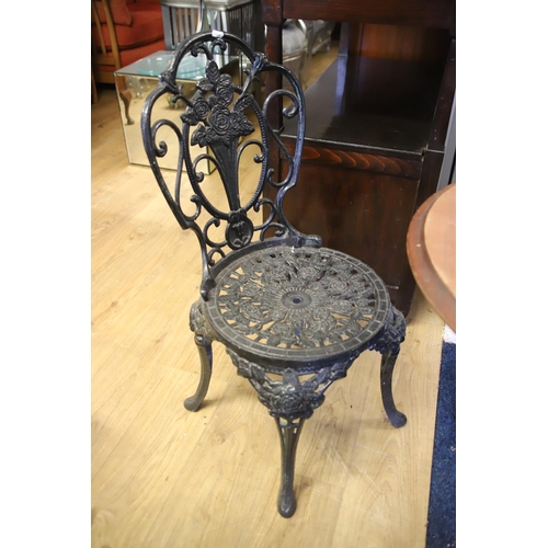 1216 - Garden Patio set comprising of a  wooden topped metal table with pierced decoration together with tw... 