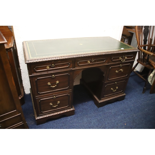 1222 - Leather topped kneehole desk which measures approx H:41 x W:48 x D:23 inches. Comes with an elongate... 