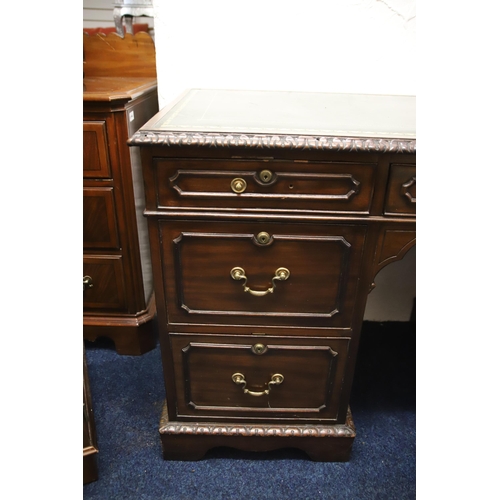 1222 - Leather topped kneehole desk which measures approx H:41 x W:48 x D:23 inches. Comes with an elongate... 