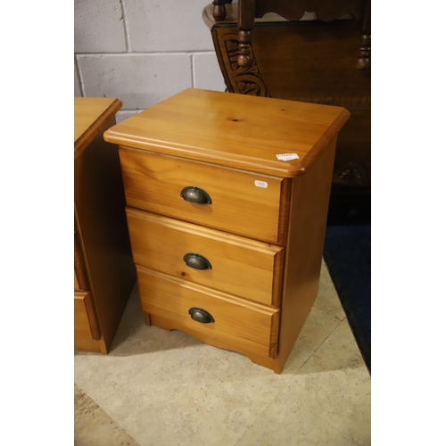 1231 - Pair of three drawer pine bedside chests.  Each measures approx H:23 x W:16 x D:13 inches. See photo... 