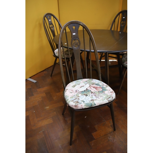 909 - Ercol Drop leaf dining table with four matching chairs in the Quaker style with swan motifs to the c... 