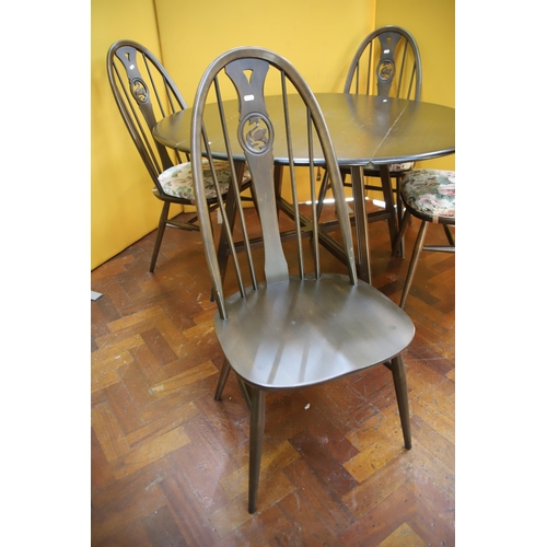 909 - Ercol Drop leaf dining table with four matching chairs in the Quaker style with swan motifs to the c... 