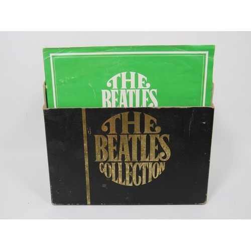 299 - Boxed Collection of 24 Vinyl 45's Beatles records with collectors box. All in sleeves and appear to ... 