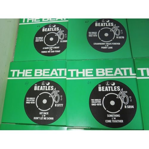 299 - Boxed Collection of 24 Vinyl 45's Beatles records with collectors box. All in sleeves and appear to ... 