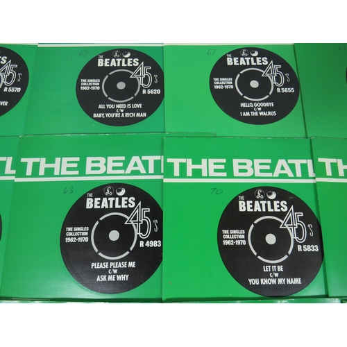 299 - Boxed Collection of 24 Vinyl 45's Beatles records with collectors box. All in sleeves and appear to ... 