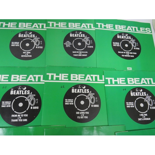 299 - Boxed Collection of 24 Vinyl 45's Beatles records with collectors box. All in sleeves and appear to ... 