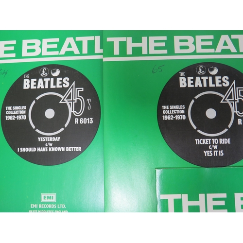 299 - Boxed Collection of 24 Vinyl 45's Beatles records with collectors box. All in sleeves and appear to ... 