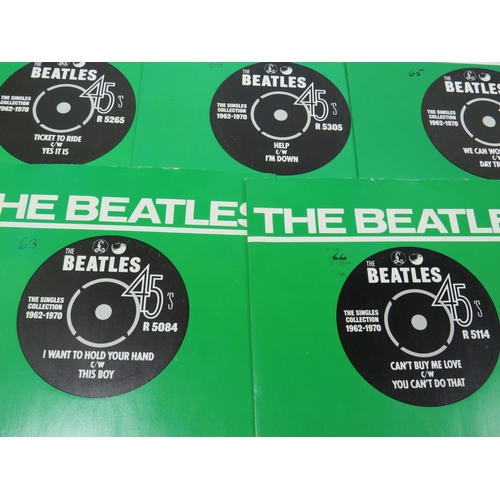 299 - Boxed Collection of 24 Vinyl 45's Beatles records with collectors box. All in sleeves and appear to ... 